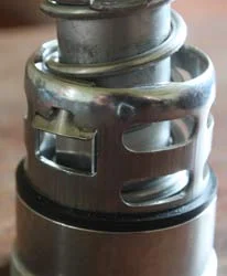 Parts of a European sanke keg valve, photographed close up